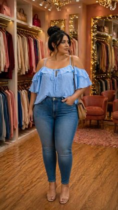 Woman in a blue off-shoulder top and skinny jeans in a clothing store