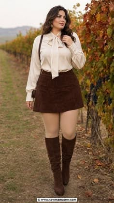 Woman in a blouse and mini skirt walking through a vineyard