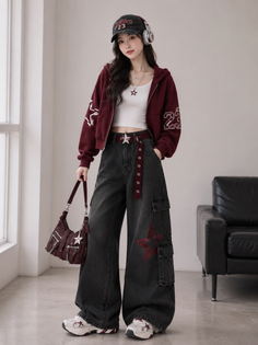 Woman in a maroon hoodie, cargo pants, and a baseball cap with headphones