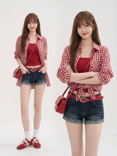 Woman in a red plaid shirt, red top, and denim shorts posing in a studio