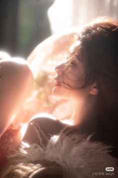 Woman with long hair in soft backlight with warm tones
