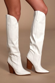 Woman wearing white knee-high cowboy boots with exposed thighs