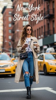Woman in a trench coat and ripped jeans walking on a city street