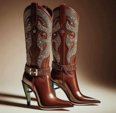 Pair of brown leather cowboy boots with rhinestones and high heels