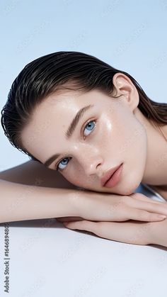 Realistic portrait of a woman with wet hair and glowing skin