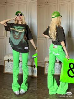 Woman with long blonde hair wearing a green cap and bright green pants indoors