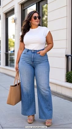 Woman with long hair wearing a white t-shirt and wide leg jeans outdoors