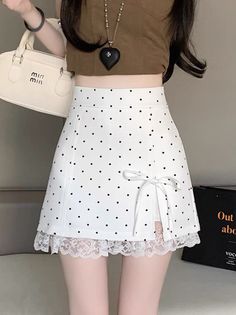 Woman wearing a polka dot skirt with lace trim and a brown crop top