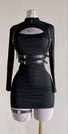 Black long-sleeve dress with a chest cutout and harness on a mannequin