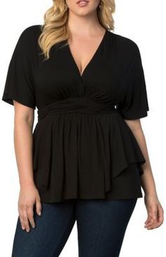 Woman in a black v-neck top and dark wash jeans