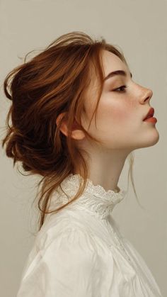 Woman with red hair and freckles wearing a white shirt with a lace collar