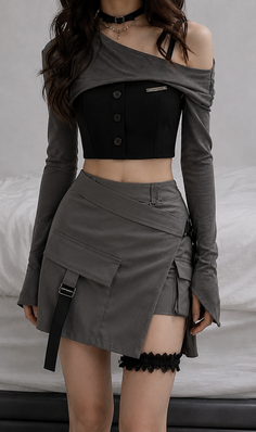 Woman in a dark gray cropped top and mini skirt with a garter on her thigh