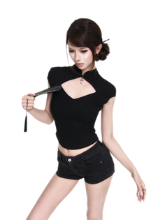 Woman in a black top and shorts holding a fan