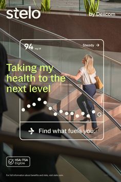 Blonde woman in business attire walking up modern indoor stairs