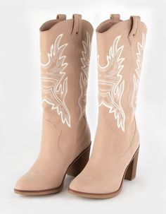 Pair of beige cowboy boots with white embroidery and high heels