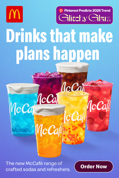 Collection of colorful iced drinks with various toppings on a blue background