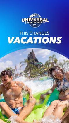 Two people on a water slide at a water park with a volcano in the background