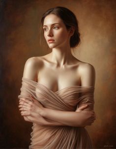 Woman with bare shoulders draped in sheer fabric, looking to the side