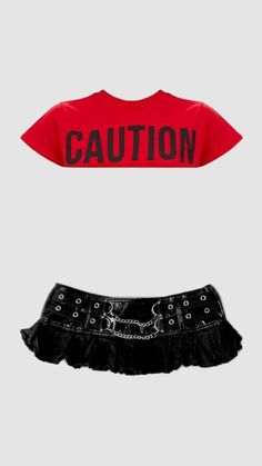 Red crop top with 'CAUTION' text and a black skirt with chains and grommets