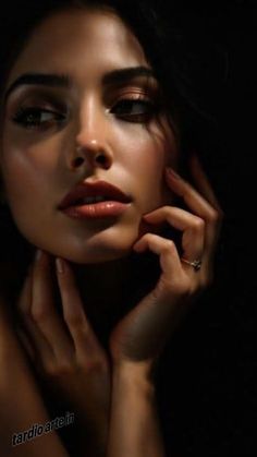 Close up portrait of a woman with dark hair and dramatic lighting