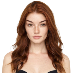 Woman with red hair and freckles wearing a black bra against a white background