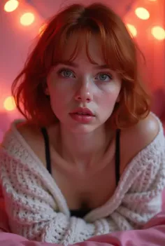 Woman with red hair and green eyes wearing a knitted cardigan and black bra indoors