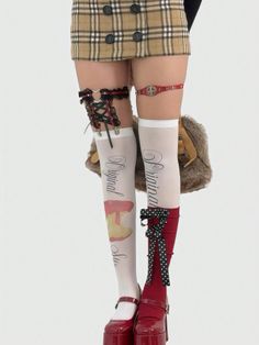Lower body of a person wearing a plaid skirt, thigh-high socks, and platform shoes
