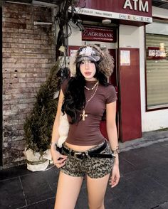 Woman in leopard print shorts and a crop top on a street