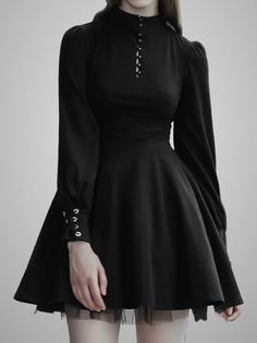 Woman in a black dress with a high collar and grommet details