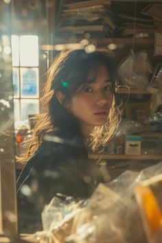 Woman with long hair in an indoor setting with warm backlight