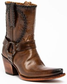 Brown leather cowboy boot with a harness strap and stacked heel on a white background