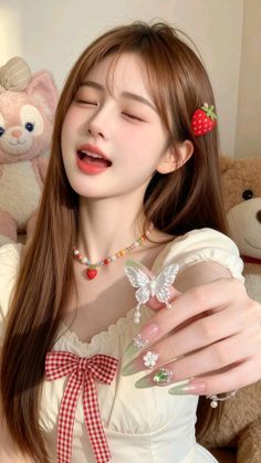 Woman with long hair, strawberry hair clip, and a butterfly ring
