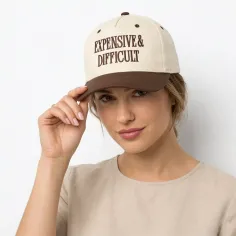 Woman in a beige shirt and a baseball cap with text on a white background
