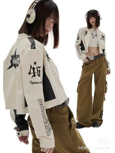 Woman in a cropped jacket and cargo pants with headphones and a punk belt