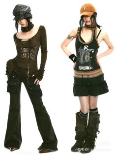 Two women in dark, alternative fashion outfits posing against a white background