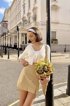 Woman with a bouquet of flowers on a city street