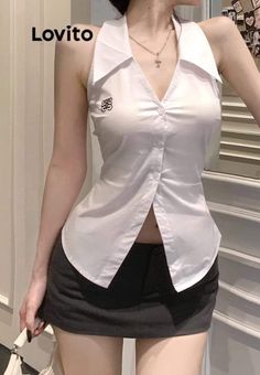 Woman in a white halter top and black mini skirt with exposed midriff