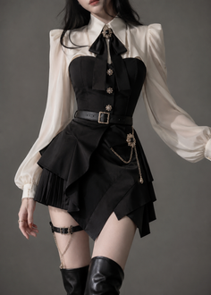 Woman in a black and white outfit with a ruffled skirt and thigh-high boots