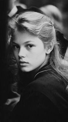 Young woman with long hair in a black and white portrait