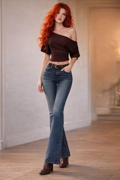 Woman with long red hair wearing an off-shoulder top and flared jeans indoors