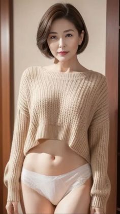 Woman with short hair wearing a cropped sweater and white underwear indoors