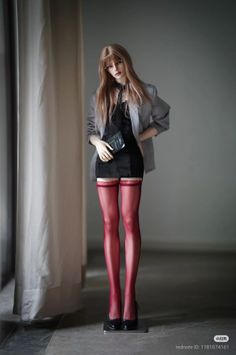 Ball jointed doll in a mini dress, blazer, and red stockings