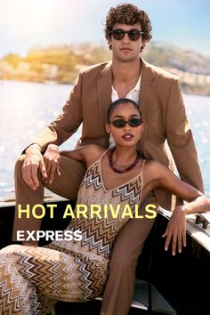Two people in sunglasses on a boat under bright sunlight