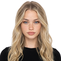Young woman with blonde wavy hair and blue eyes looking directly at the camera