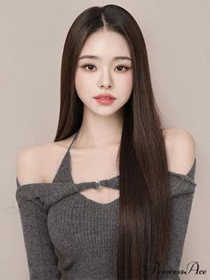 Woman with long dark hair wearing an off-shoulder top with a cutout