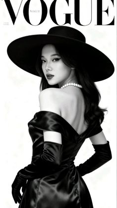 Woman in a black off-shoulder dress and wide-brim hat with a pearl necklace