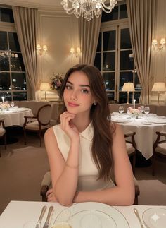Woman with long hair in a sleeveless top at a restaurant at night