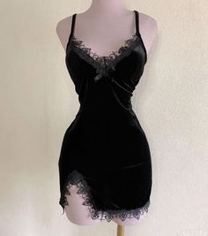 Black velvet lingerie mini dress with lace trim on a mannequin