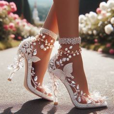Close up of feet wearing ornate high heels with butterfly and rhinestone designs