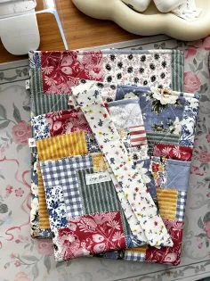 Close-up overhead shot of a colorful quilted fabric with various patterns